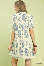 Flowy short-sleeve dress back with blue paisley print and gathered yoke