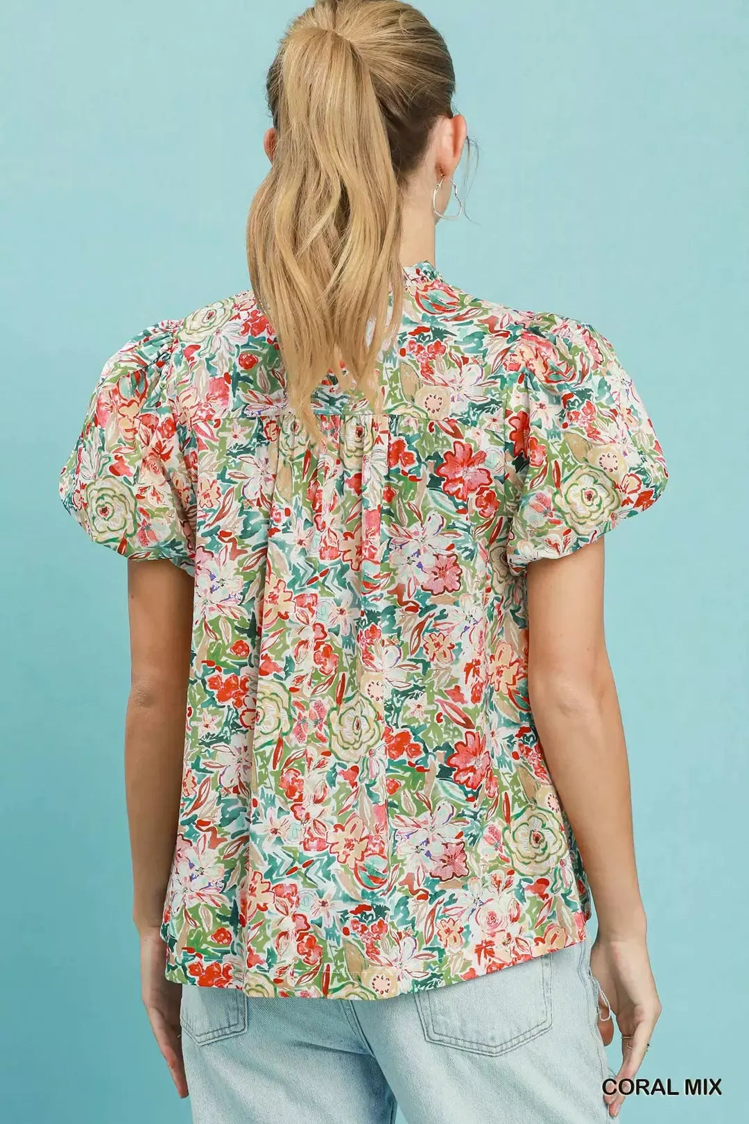 Floral puff-sleeve blouse in coral mix, back view with gathered shoulder detail