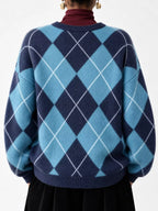 Fuzzy argyle knit sweater back view in sky blue and navy with white diamond pattern