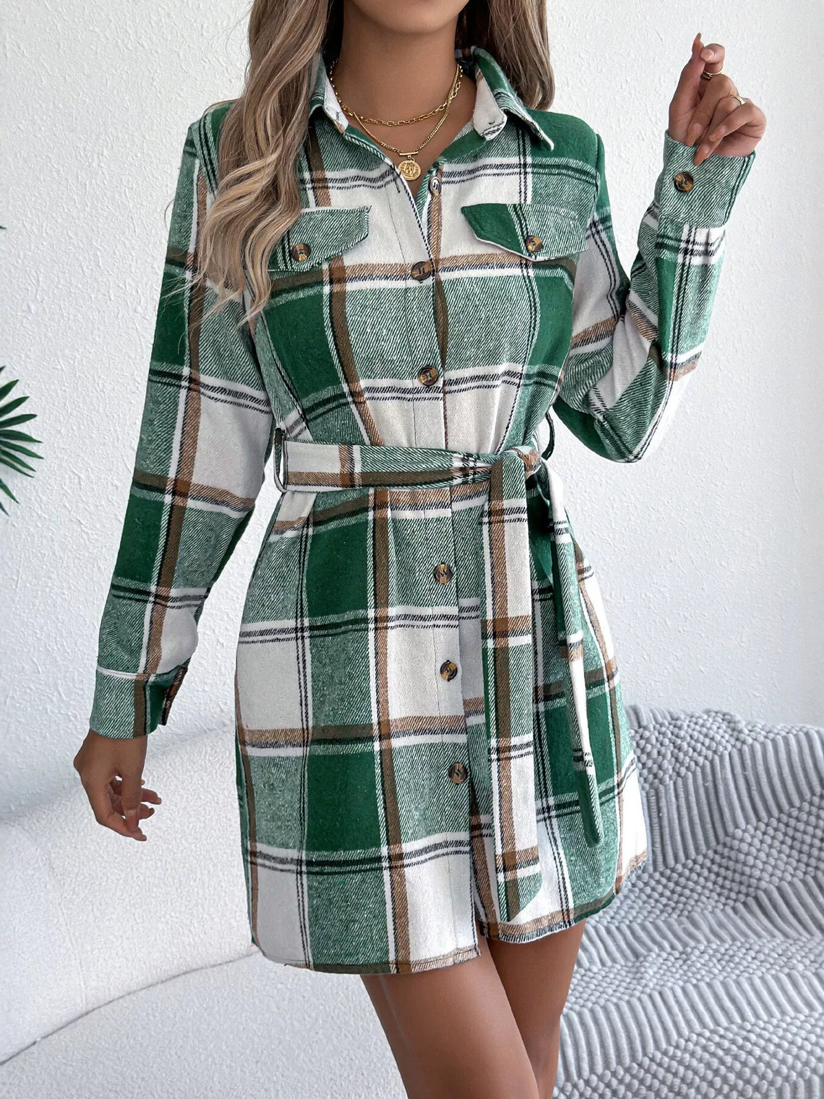 Green plaid shirt dress with button-up front and tied waist belt, long sleeves
