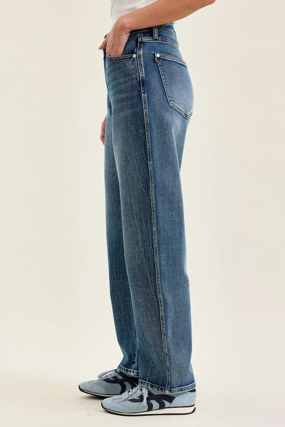 Petite wide-leg indigo wash jeans, side profile with back yoke and belt loops