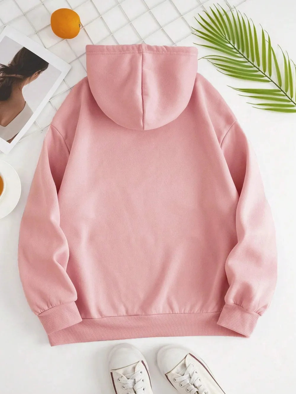 Blush pink back view pullover hoodie with drawstring hood and ribbed cuffs