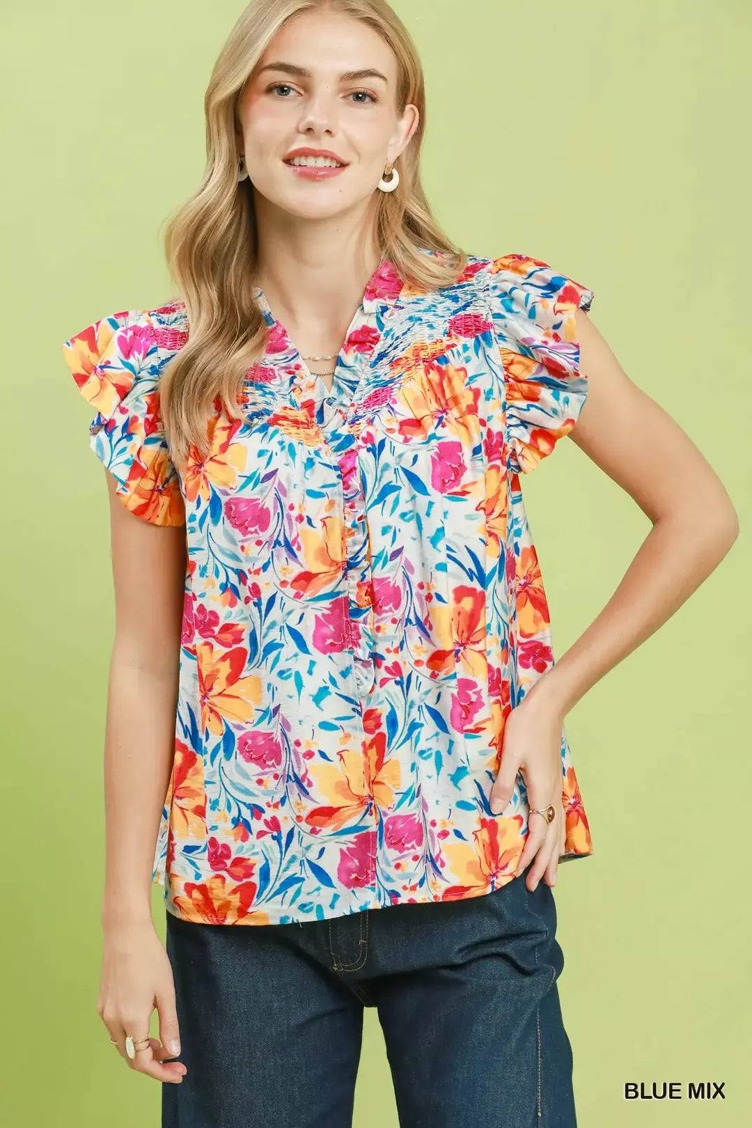 Floral blouse with smocked yoke and ruffle sleeves, blue base with colorful flowers