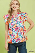 Floral blouse with smocked yoke and ruffle sleeves, blue base with colorful flowers