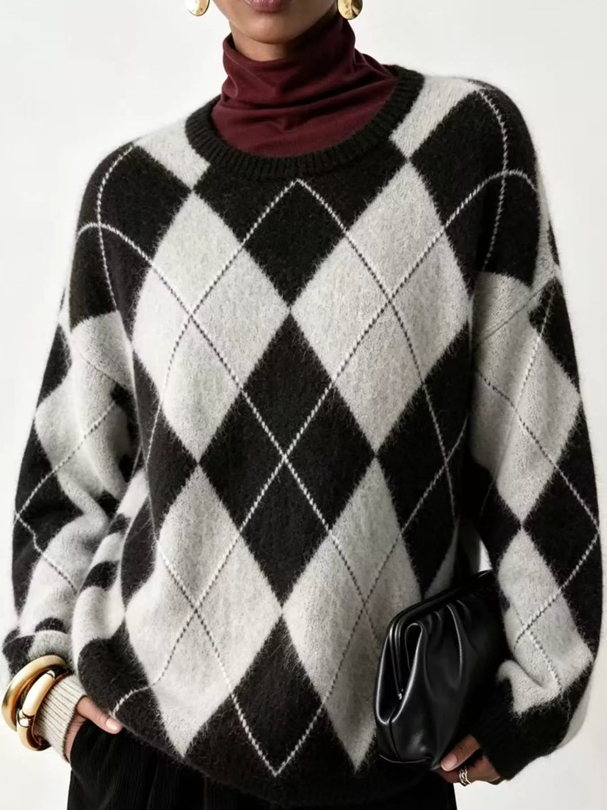 Fuzzy argyle knit sweater in black and cream with white diamond argyle pattern