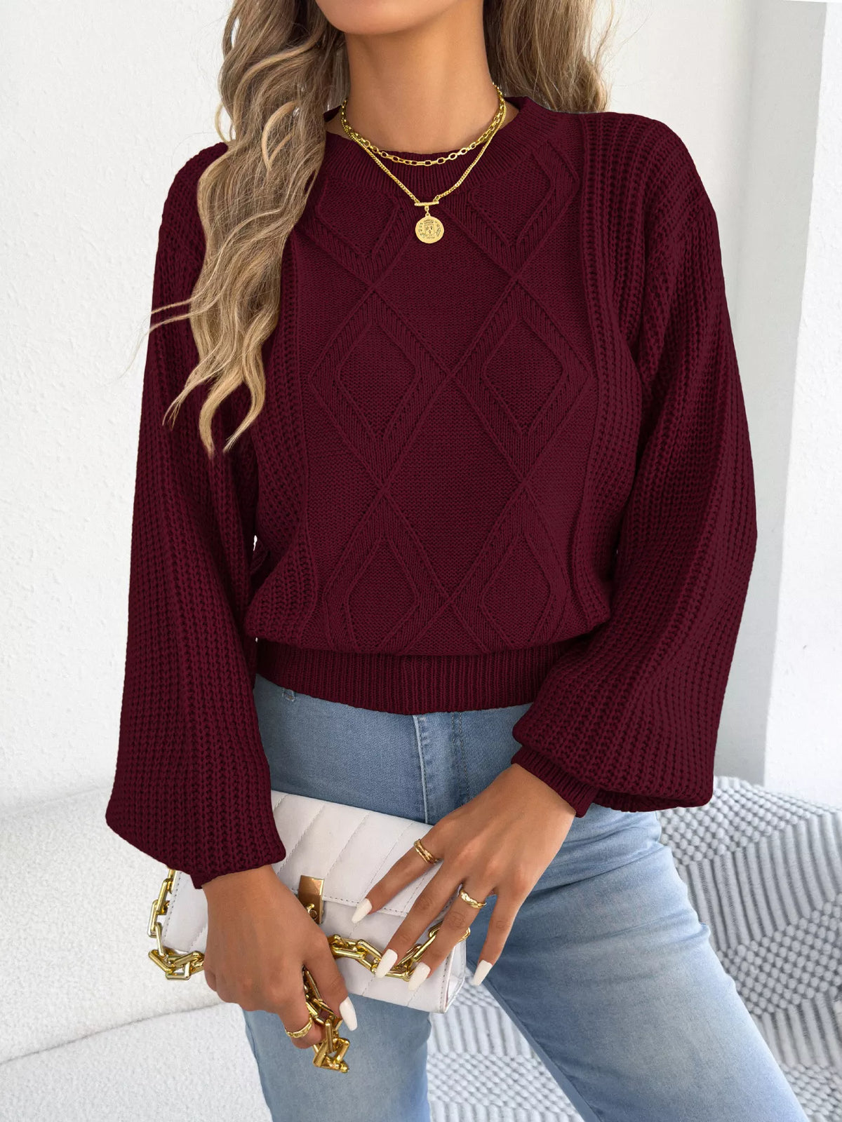 Wine red argyle lantern-sleeve sweater with ribbed hem and diamond knit pattern