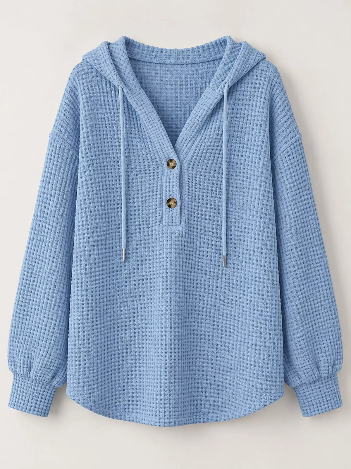 Light blue waffle-knit button hoodie with hood, gold buttons, and drawstring ties.