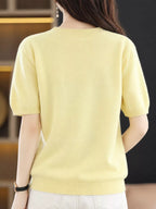 Yellow round-neck short-sleeve sweater, back view with ribbed hem and cuffs