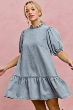 Light wash denim mini dress with ruffled high neck and puff sleeves, A-line tiered skirt