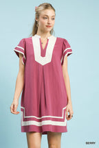 Berry linen short-sleeve dress with contrast V-neck and white trim panels, straight hem.