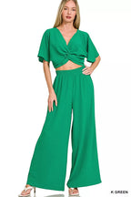 Women's green twisted-front crop top and wide-leg pants set with elastic waist