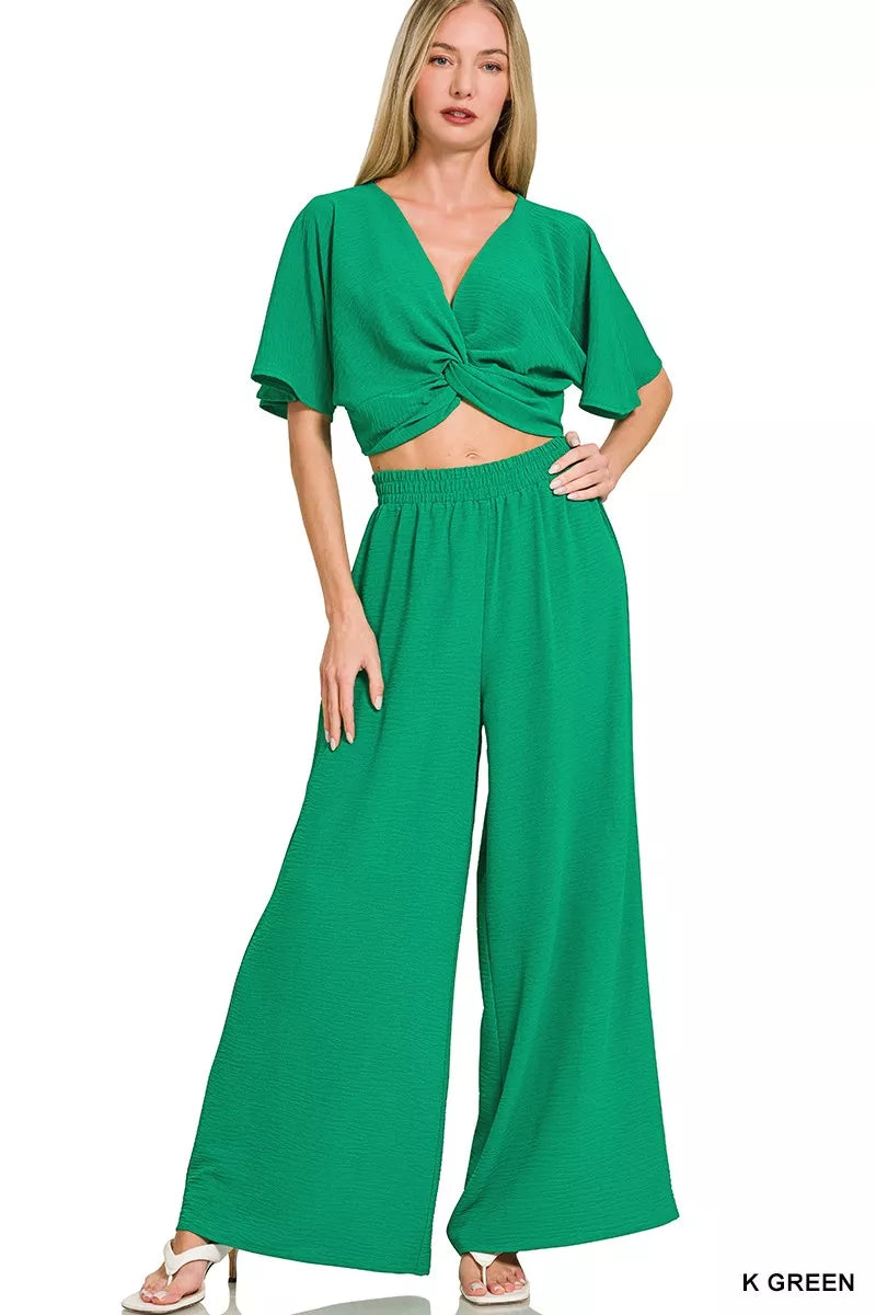 Women's green twisted-front crop top and wide-leg pants set with elastic waist