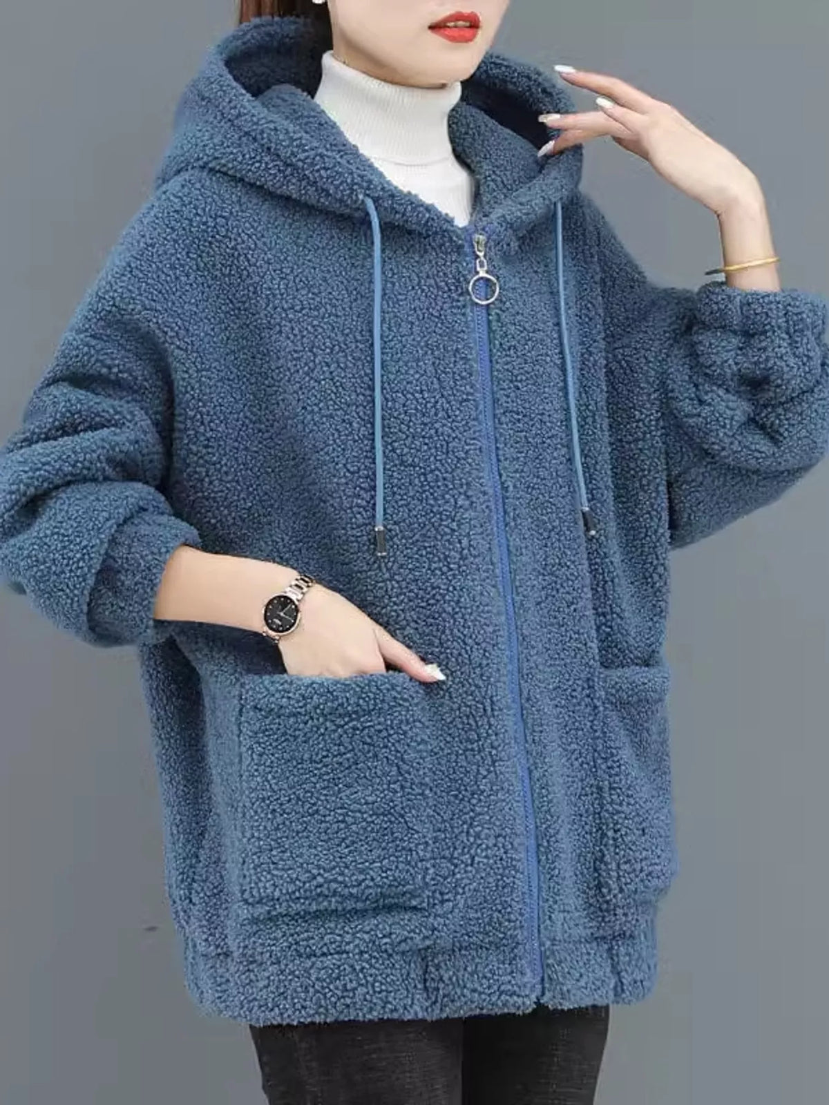 Blue fleece zip-up hoodie with hood, front zipper, and large side pockets