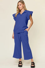 Blue ruffle-sleeve top and wide-leg pants set with relaxed neckline and ruffled shoulders
