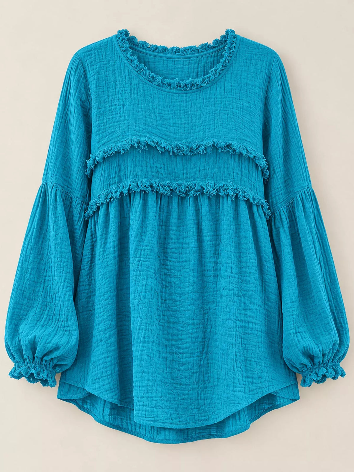 Teal peplum blouse with frayed yoke bands and billowy puff sleeves
