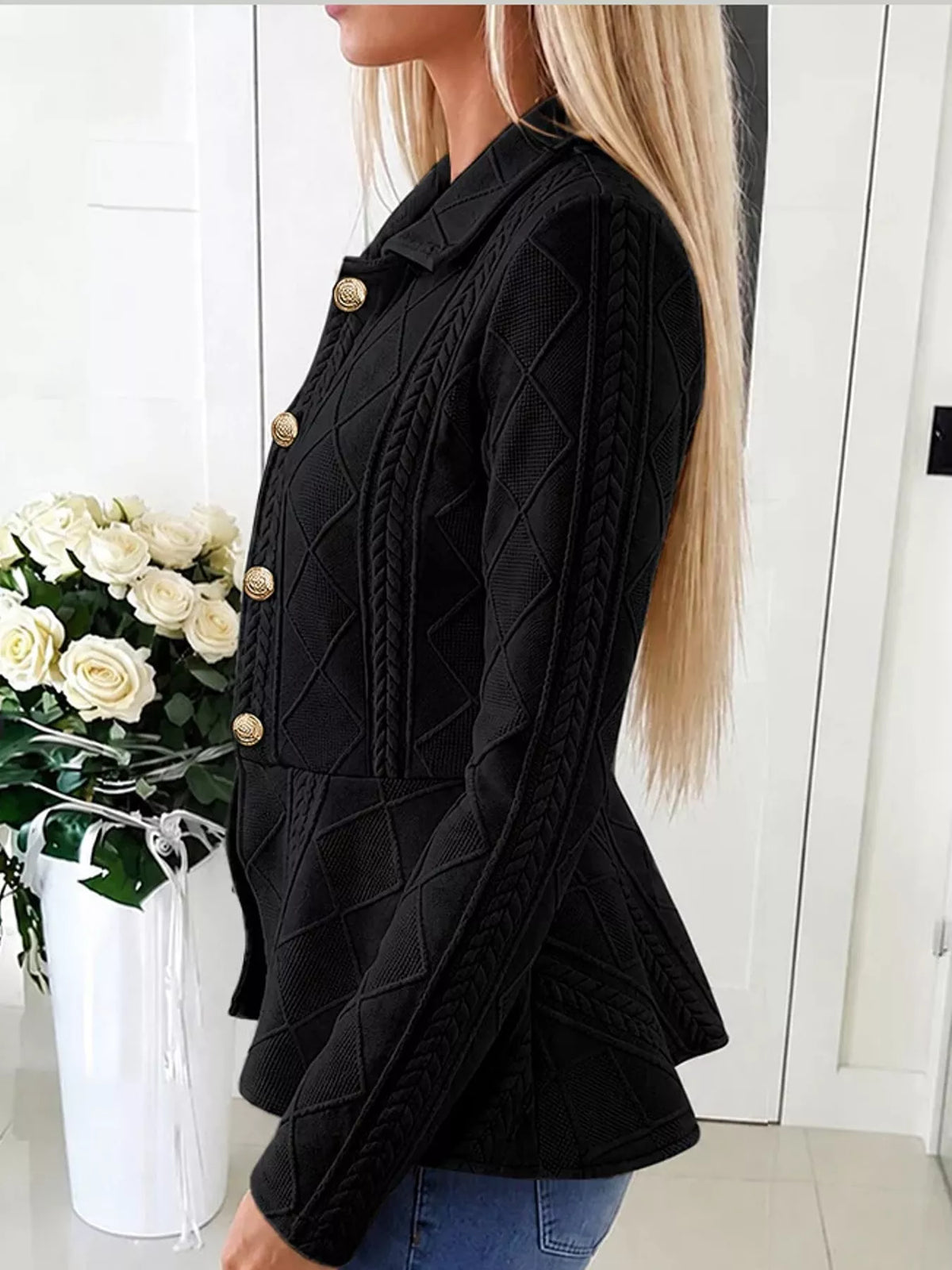 Black cable-knit button-up cardigan with gold buttons and stand collar, peplum hem.