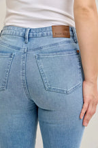 Light blue mid-rise jeans with Judy Blue label and front patch pocket
