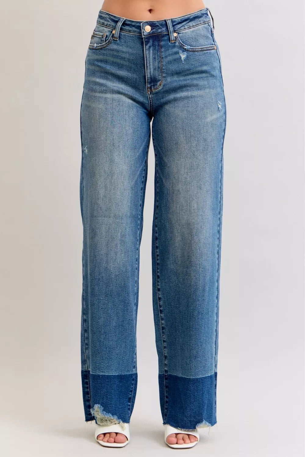 High-waist straight jeans in medium blue denim, front view with raw hem