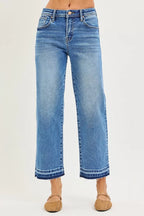 Medium blue relaxed jeans with cuffed hems, front seams, button closure