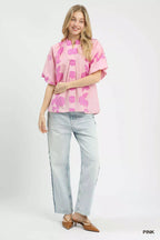 Pink floral collared blouse with smocked yoke and short puff sleeves