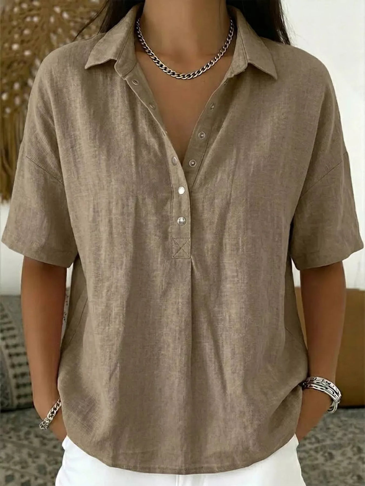 Khaki brown short-sleeve snap-front shirt with collared V-neck placket