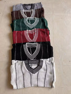 Stacked V-neck textured knit sweaters in brown, green, red, black, and white