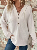 Cream waffle-knit button hoodie with hood, long sleeves, and front button closure