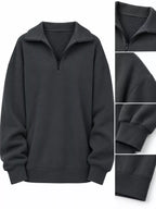Oversized zip-neck sweatshirt in dark charcoal, front profile with half-zip detail