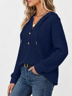 Navy waffle-knit button hoodie with hood and front button placket; long sleeves.
