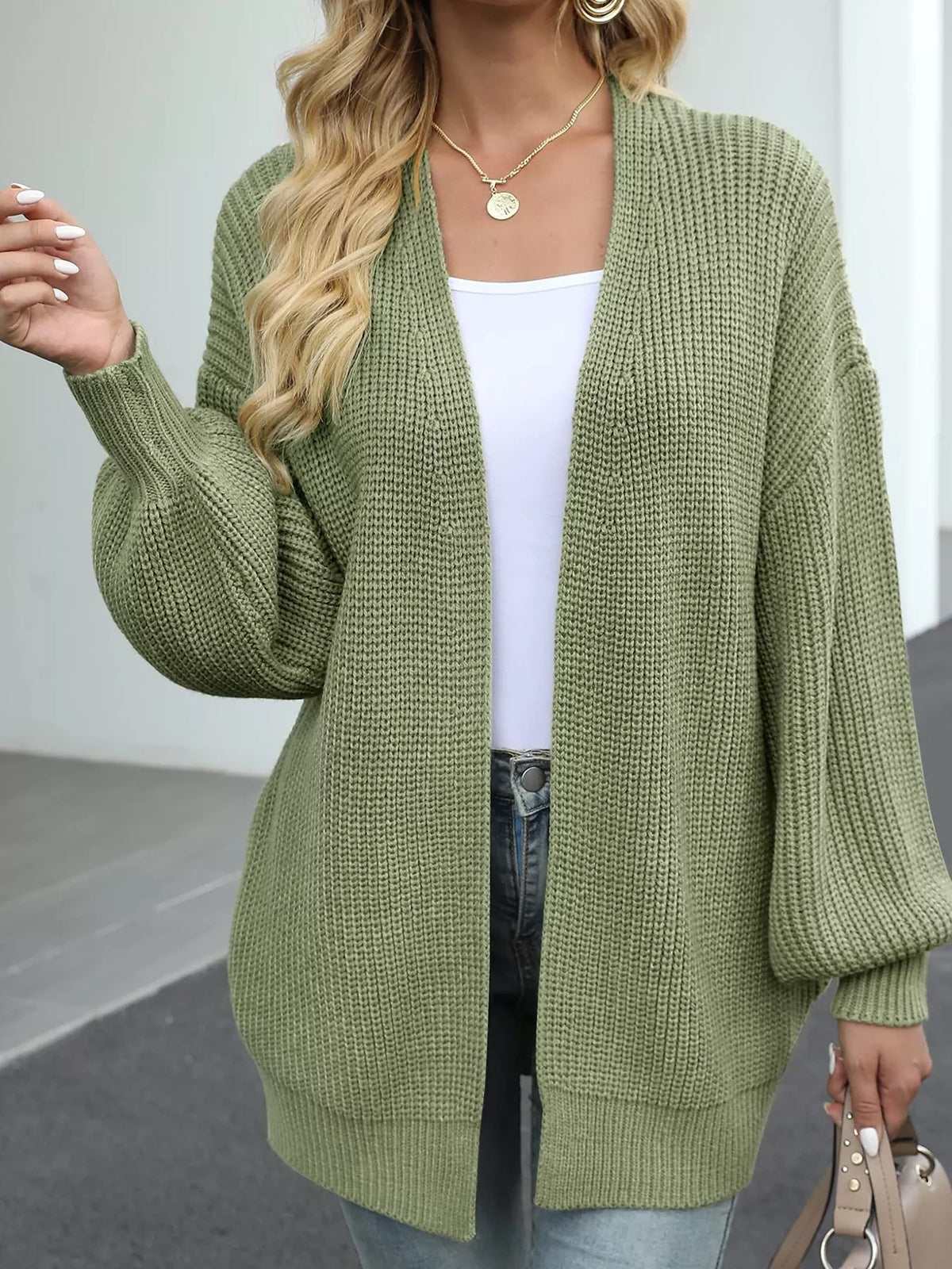 Chunky knit lantern sleeve cardigan in olive green, front view, oversized textured knit.