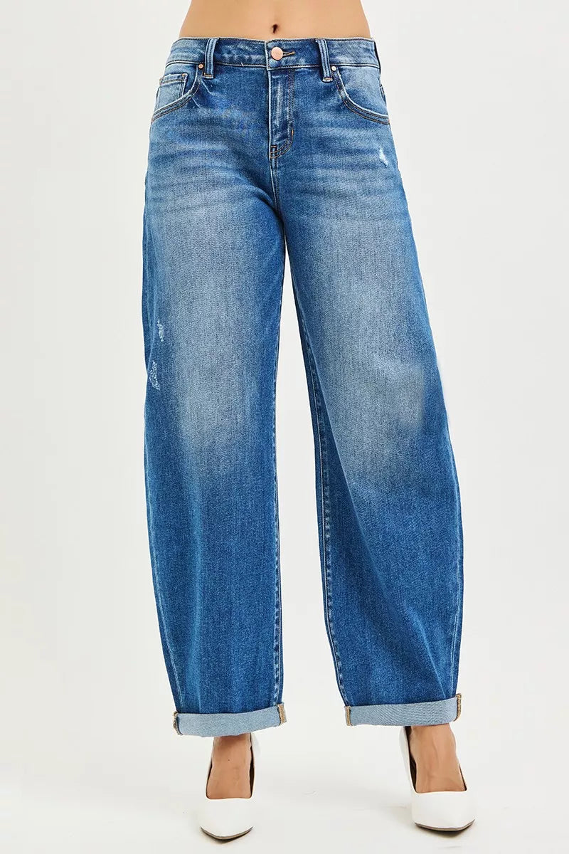 Dark wash mid-rise barrel jeans with double roll cuffs and button front