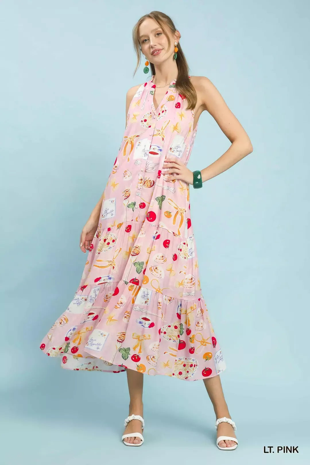 Light pink halter midi dress with tiered skirt and colorful abstract fruit and star print