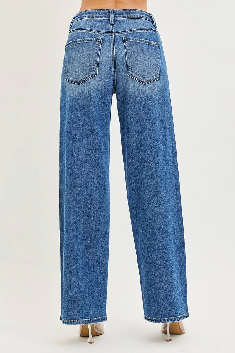 Women's medium-wash denim jeans back view with two rear pockets and belt loops