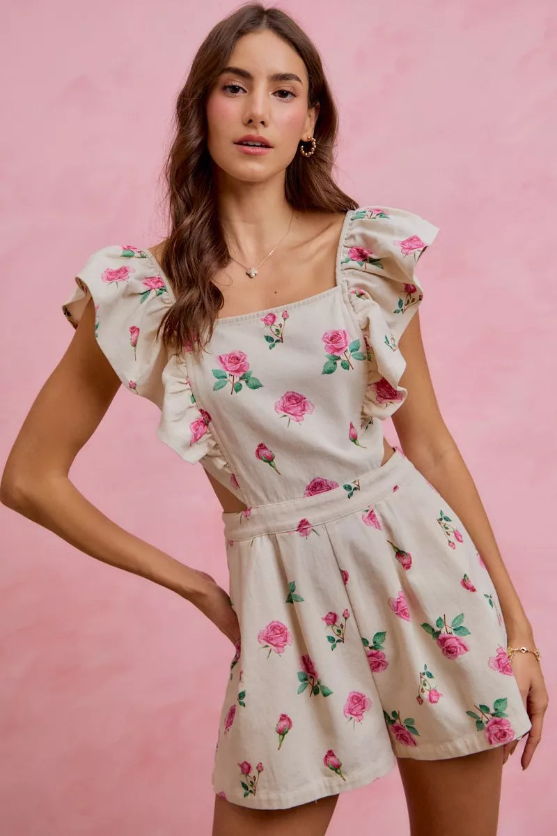 Ivory floral print denim romper with ruffled cap sleeves and gathered belted waist