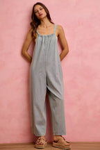 Light denim wide-leg overalls with gathered neckline and wide leg