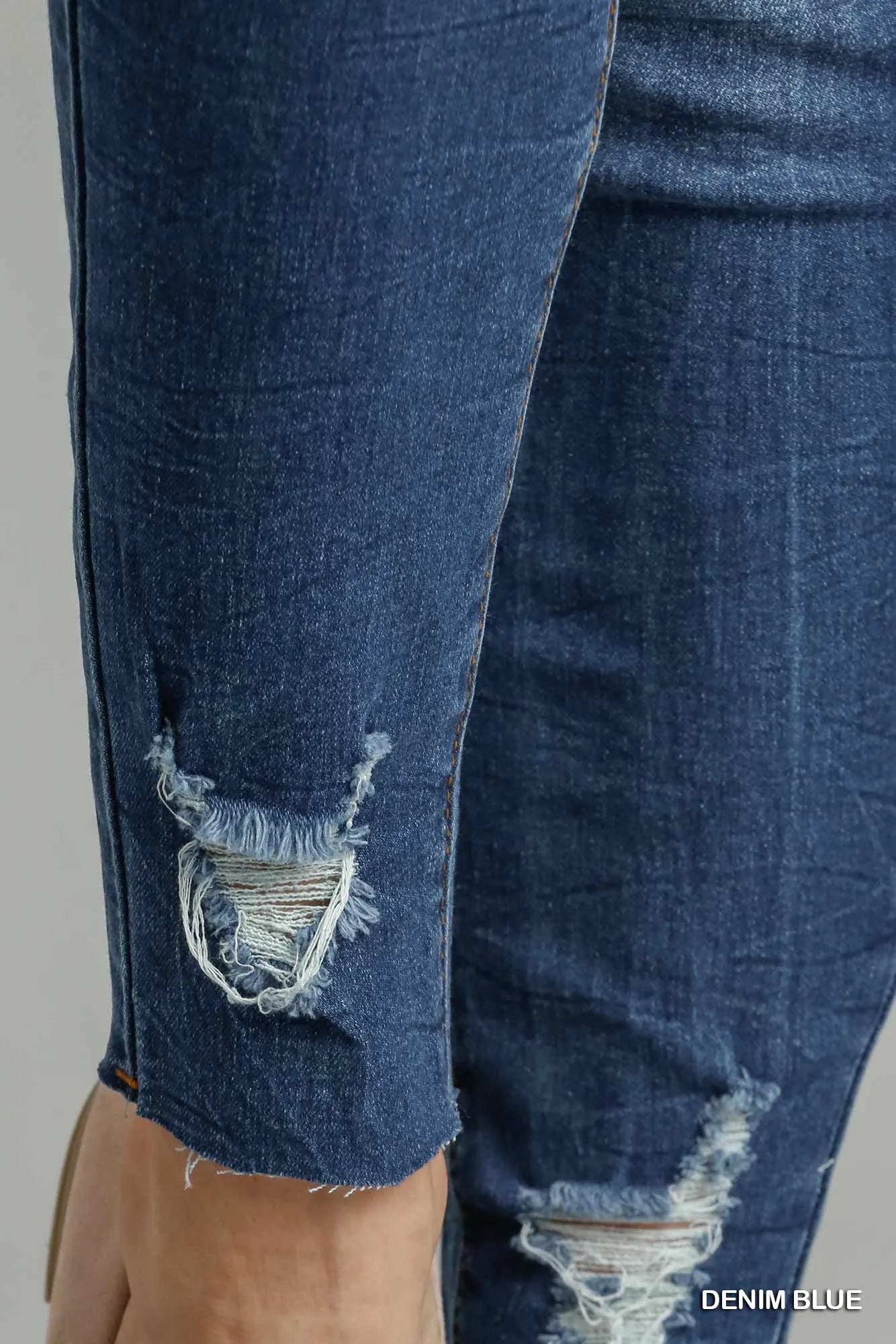 High-Waisted Distressed Skinny Jeans – Medium Blue Stretch Denim