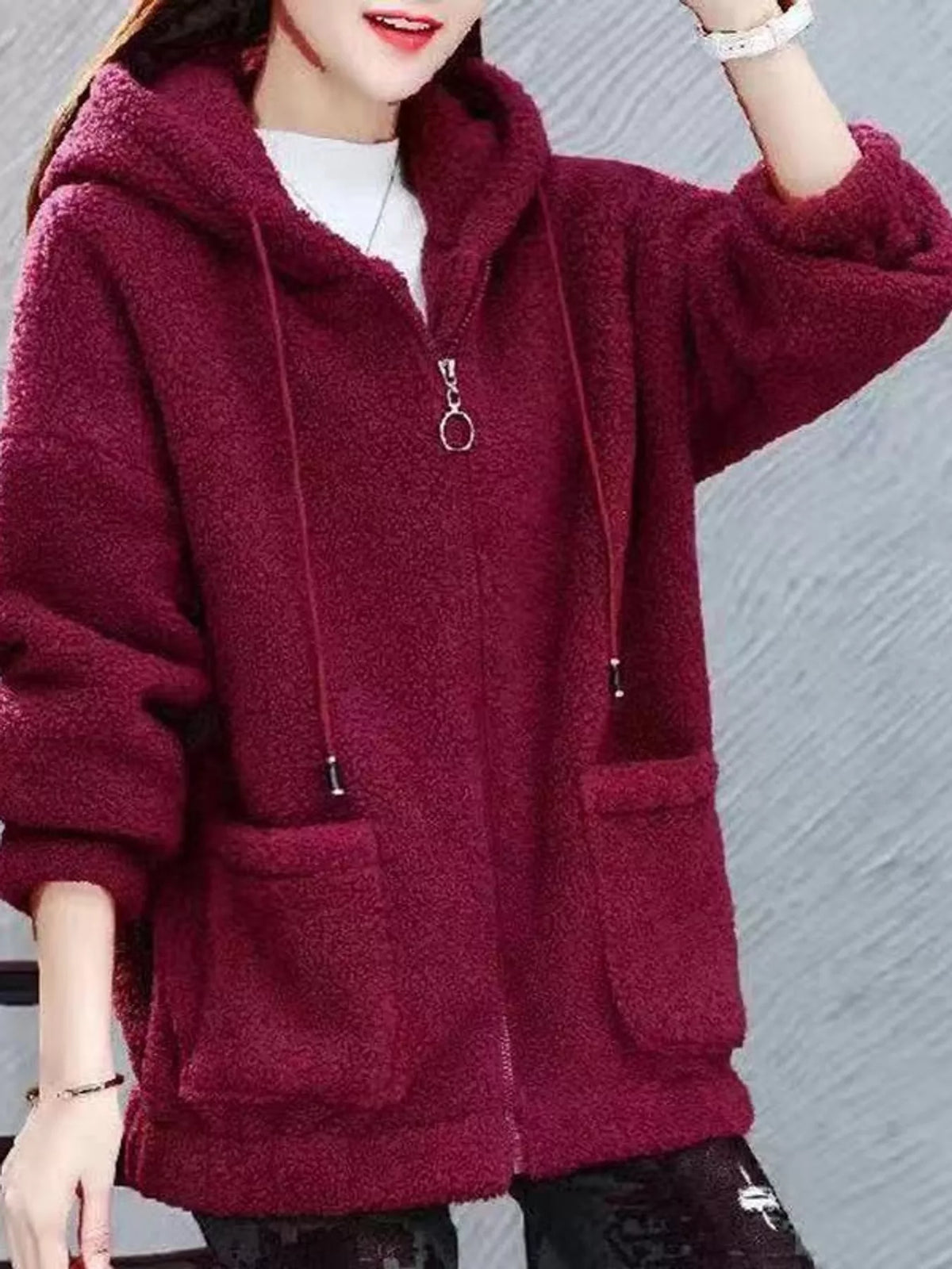 Burgundy fleece zip-up hoodie with drawstring hood, zipper pull, and front patch pockets.