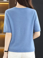 Light blue round-neck short-sleeve sweater with ribbed hem and cuffs