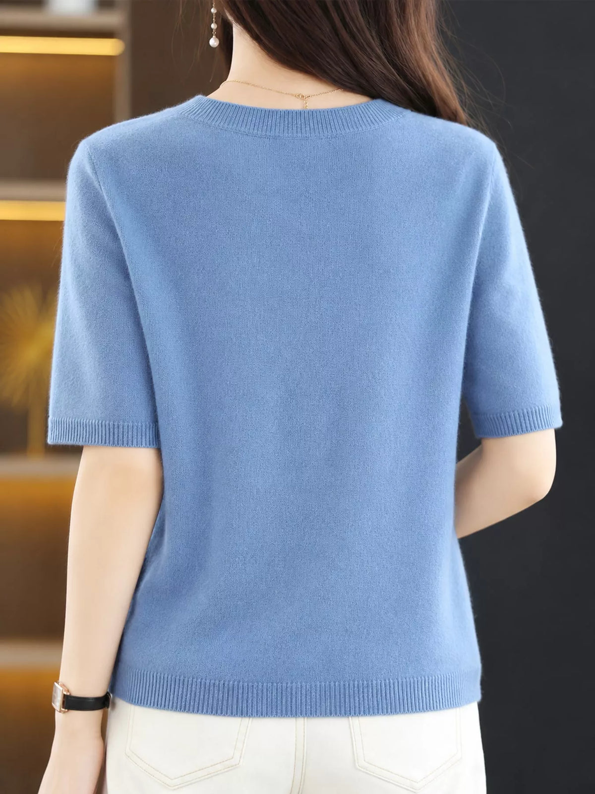 Light blue round-neck short-sleeve sweater with ribbed hem and cuffs