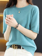 Teal crew-neck short-sleeve sweater knit with ribbed cuffs and straight hem