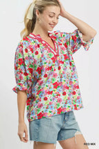 Red-and-blue mixed floral ruffle top with elbow-length sleeves and V-neck