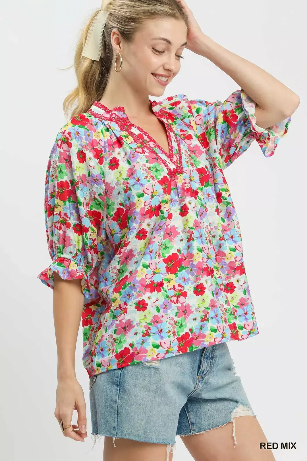 Red-and-blue mixed floral ruffle top with elbow-length sleeves and V-neck