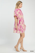 Pink and cream patterned mini dress with V-back and short puff sleeves