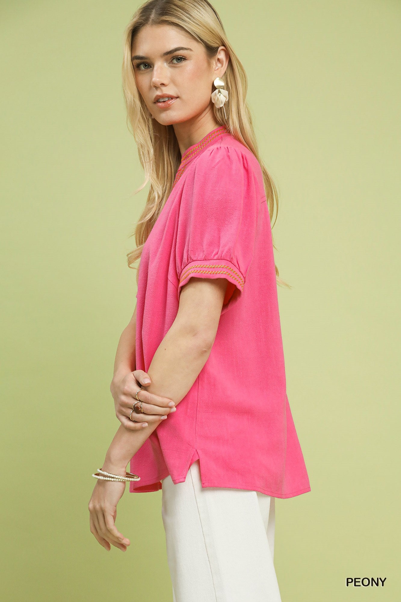 Embroidered linen puff-sleeve blouse in peony pink, gathered sleeve cuffs