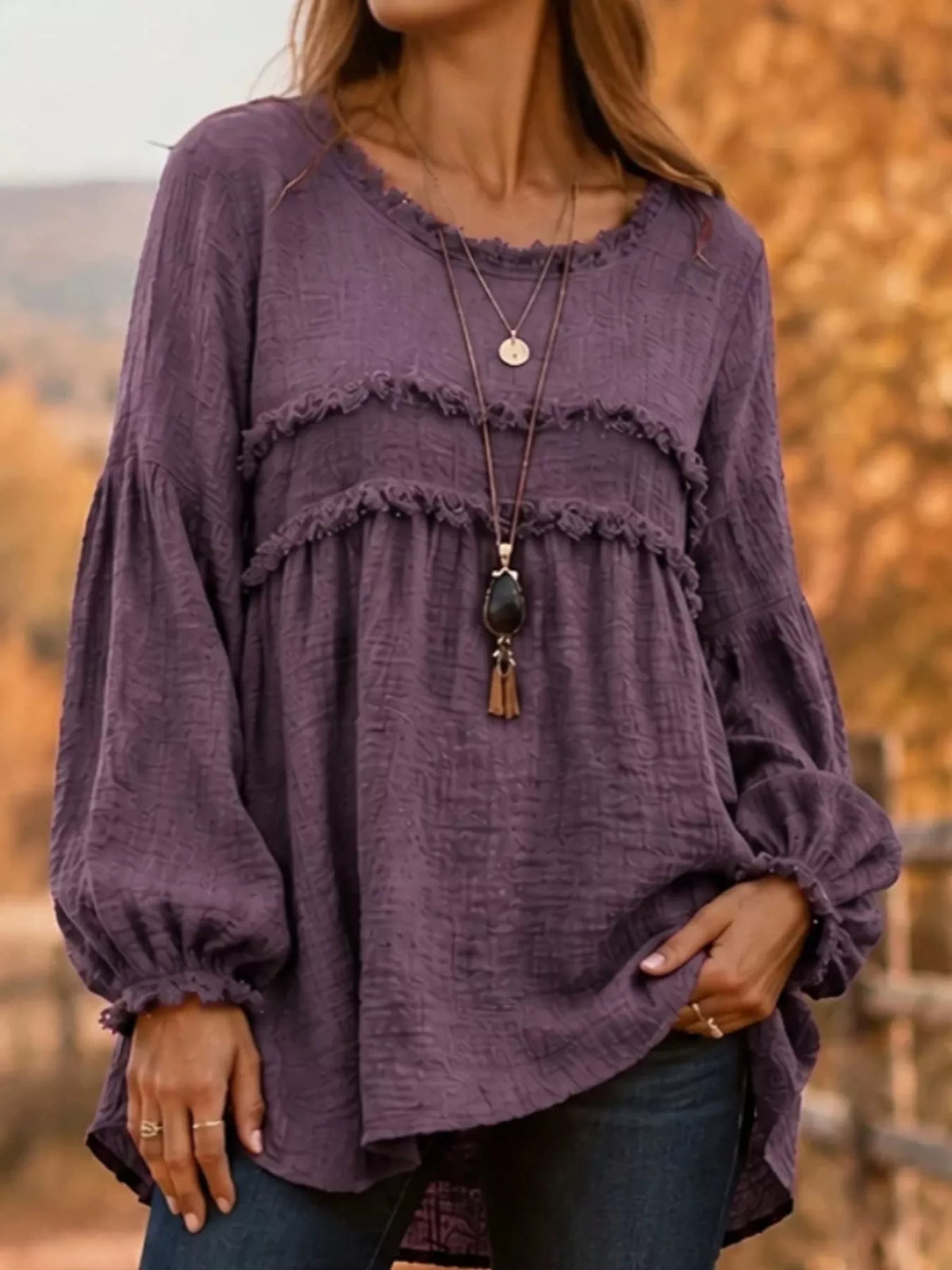 Purple frayed-trim peplum blouse with tiered ruffle yoke and long puff sleeves
