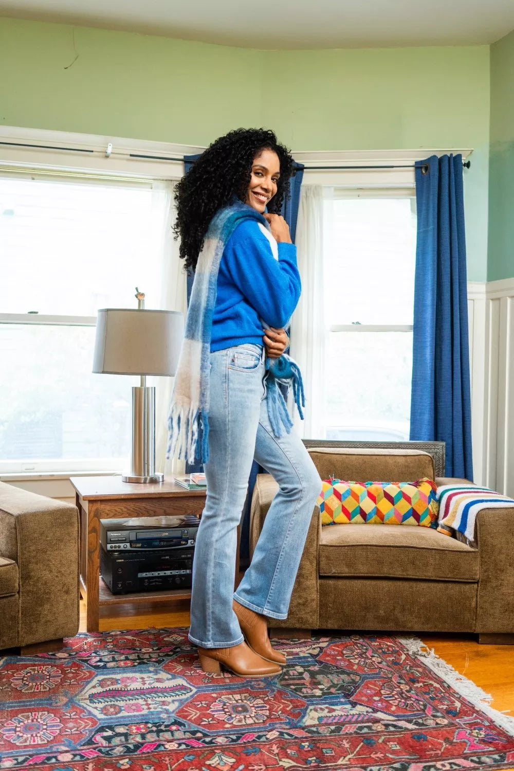 Mid-rise thermal bootcut jeans in light wash denim with flared legs and cuffed look