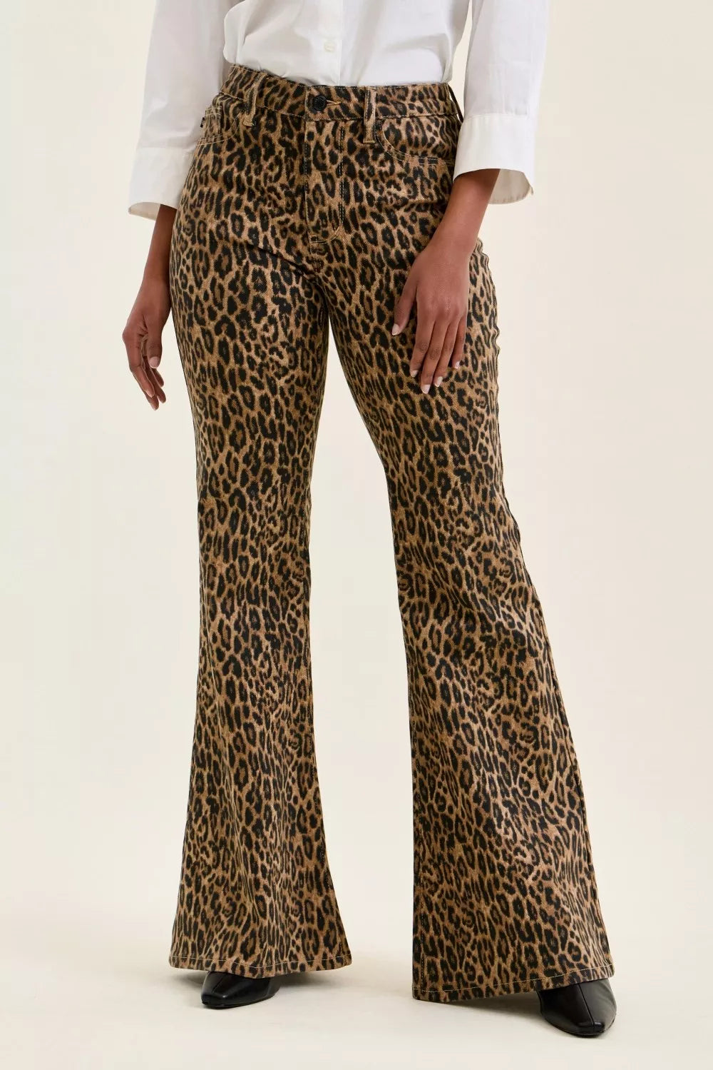 Leopard print flare jeans with fitted waist and wide bell-bottom legs.