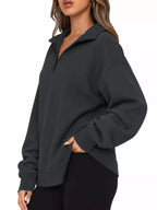 Oversized zip-neck sweatshirt in dark charcoal, relaxed fit with half-zip collar