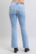 Light wash mid-rise bootcut jeans with embroidered back pockets and straight hem