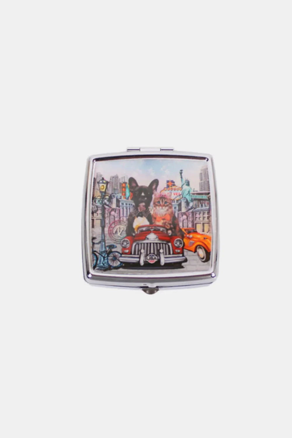 Nicole Lee metallic square pill case with city illustration print, closed.